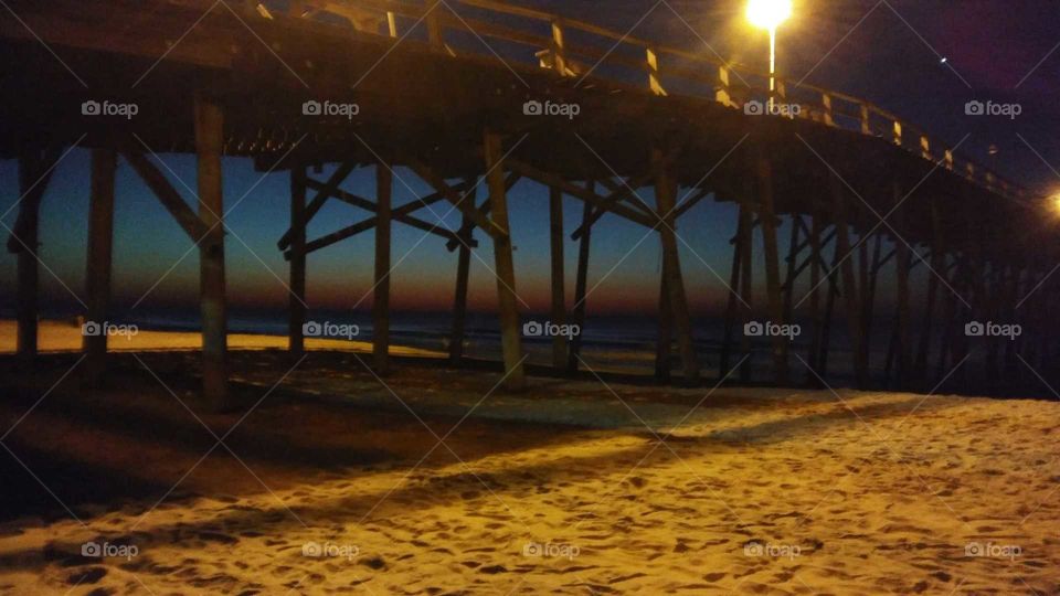 sunrise under the pier