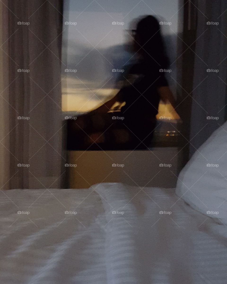 a blurry photo on a Window of a hotel