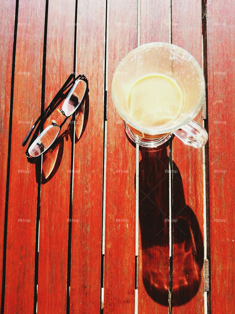 coffee and glasses on rustic table top view