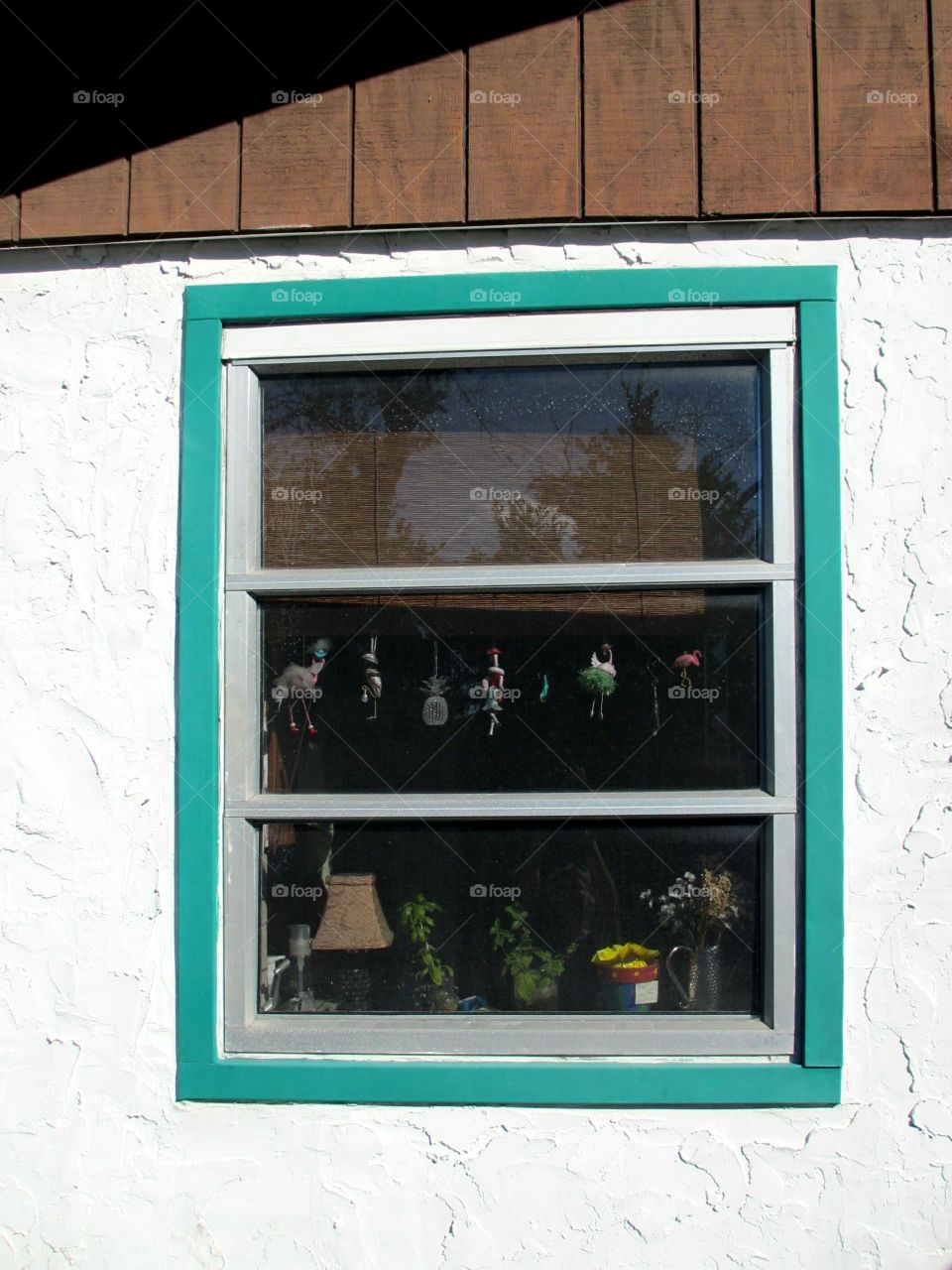 Window Kitsch. Cottage kitchen window full of kitsch