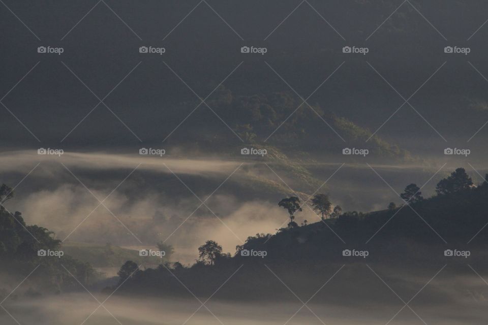 View of mountain in fog