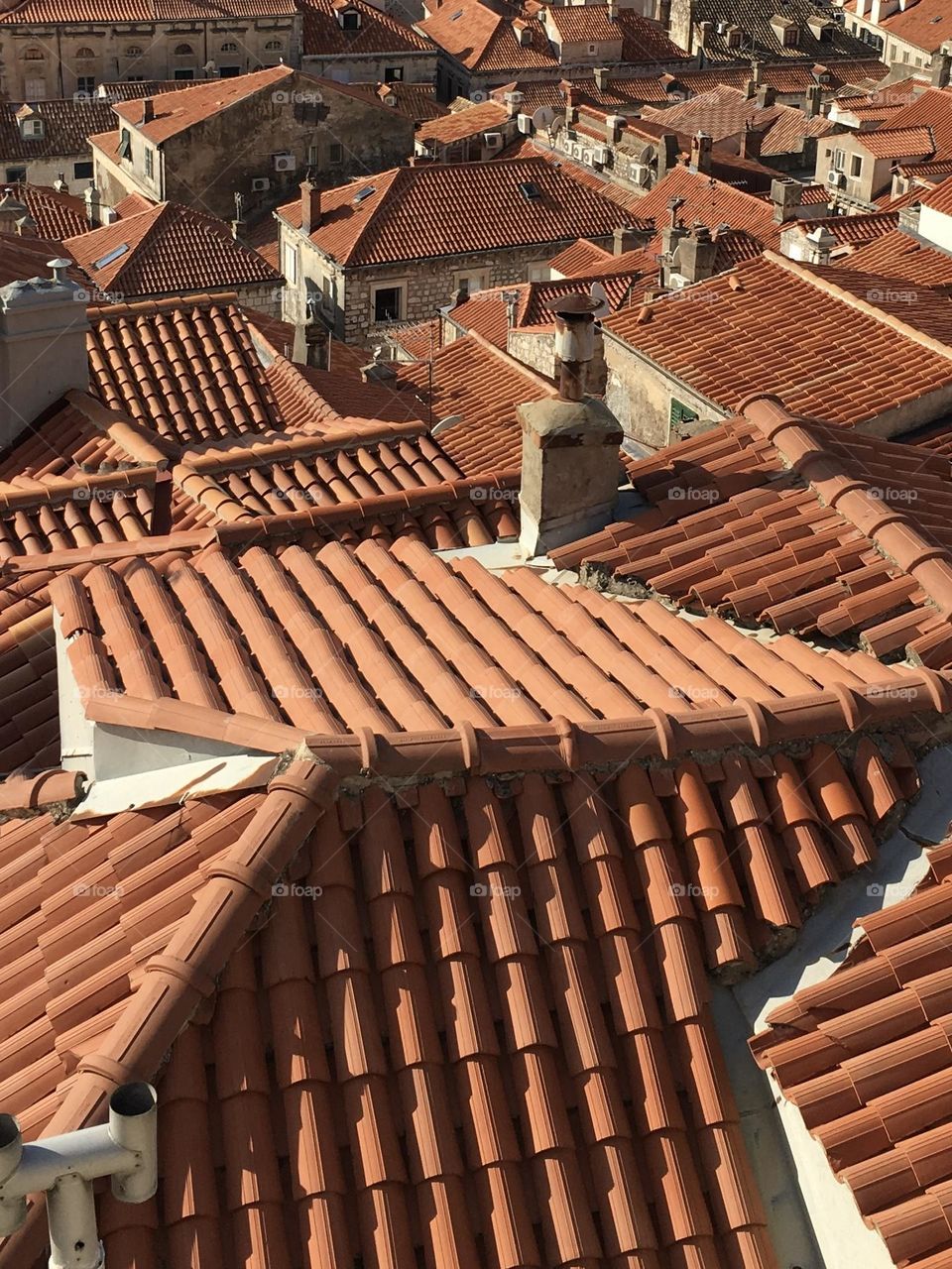 The orange roofs of Dubrovnik radiating heat from the hot summer sun.