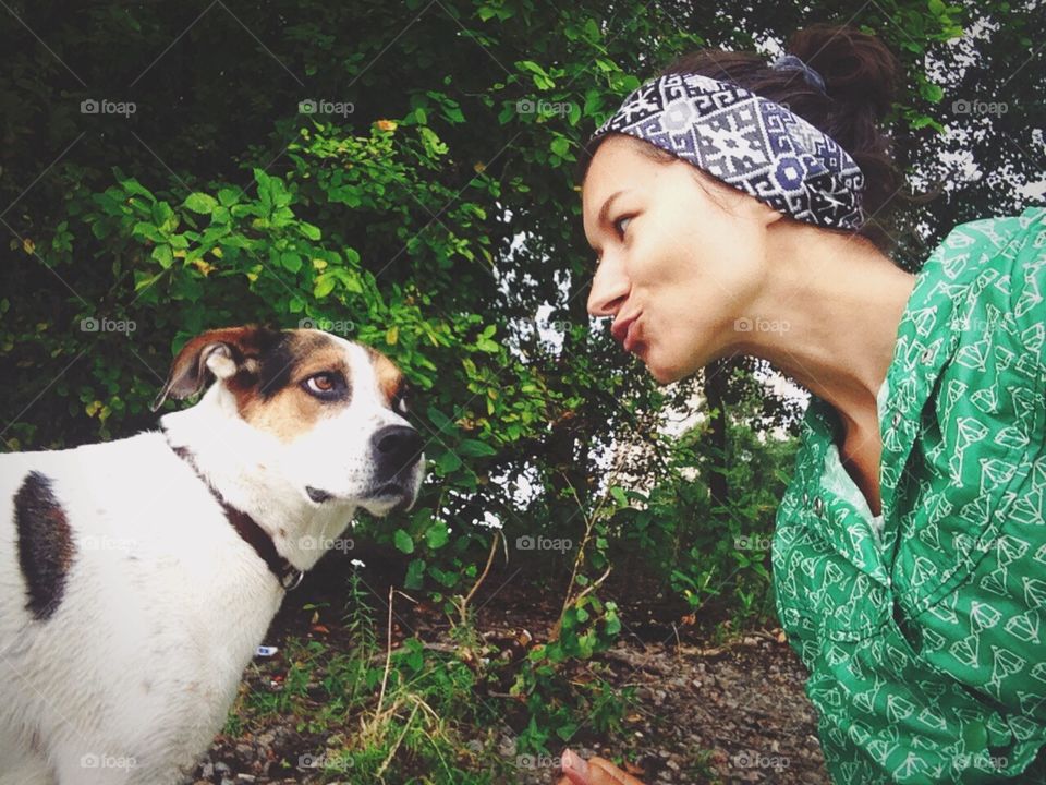 Girl playing with cute dog 