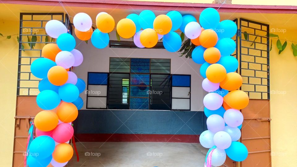 Welcome door filled with colorful balloons