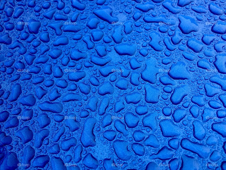 Water droplets on blue. Water droplets on a blue background 