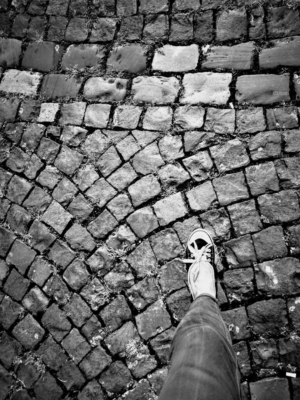 Fuss auf Kopfsteinpflaster