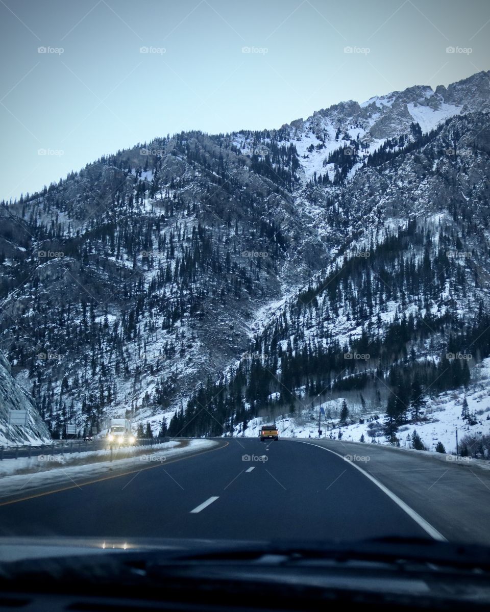Travel through the snow covered mountains.