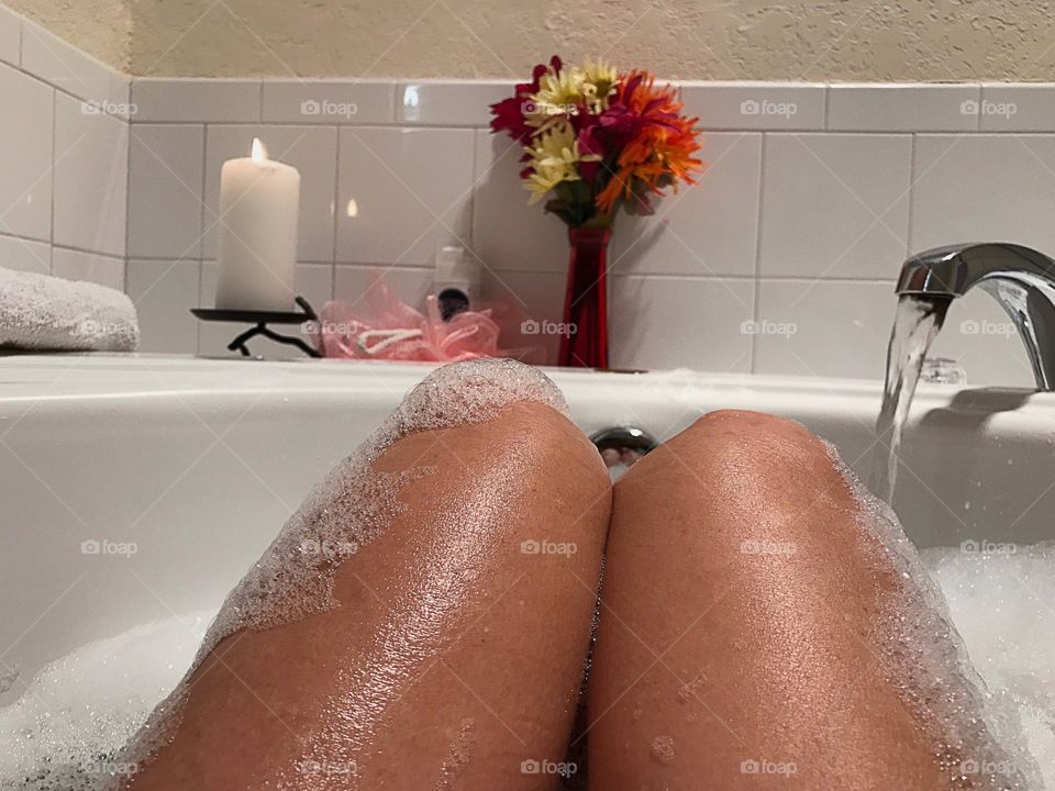 Relaxing bubble bath part of a beauty routine.
