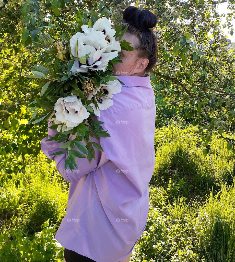 Green spring day girl with peonies