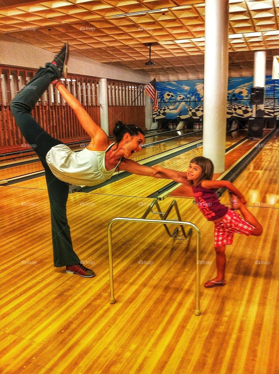 Mom and daughter doing yoga