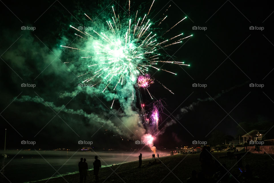 Fireworks on the coast reflection