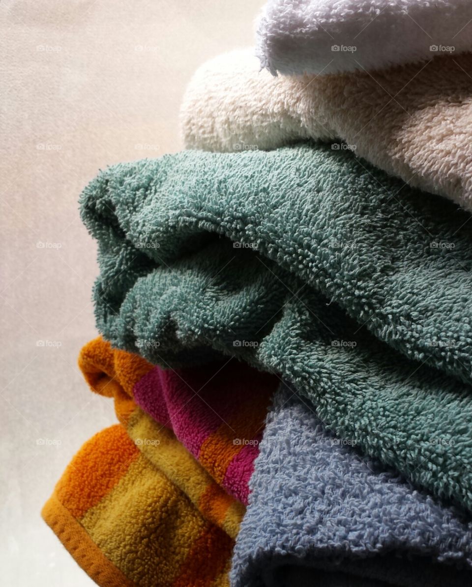 Towels. Clean towels next to the bathroom window.