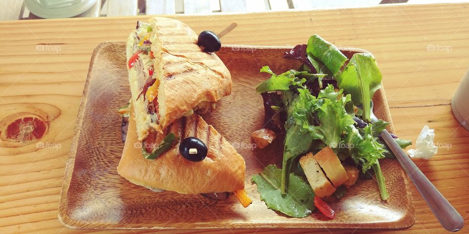 mixed greens salad with roast beef sandwich