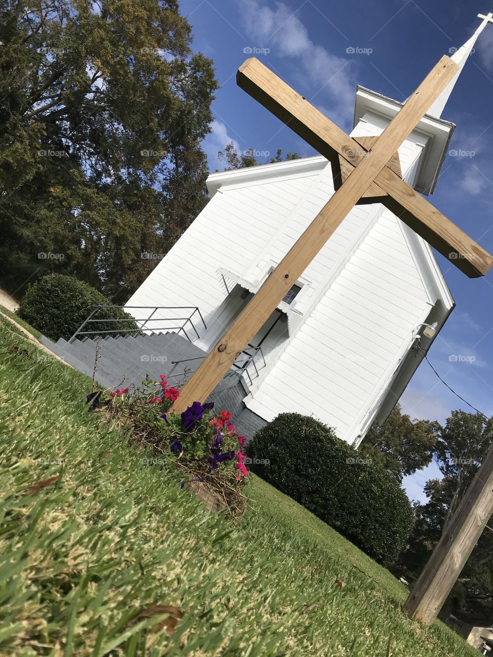 Cross in focus in front of this beautiful church!