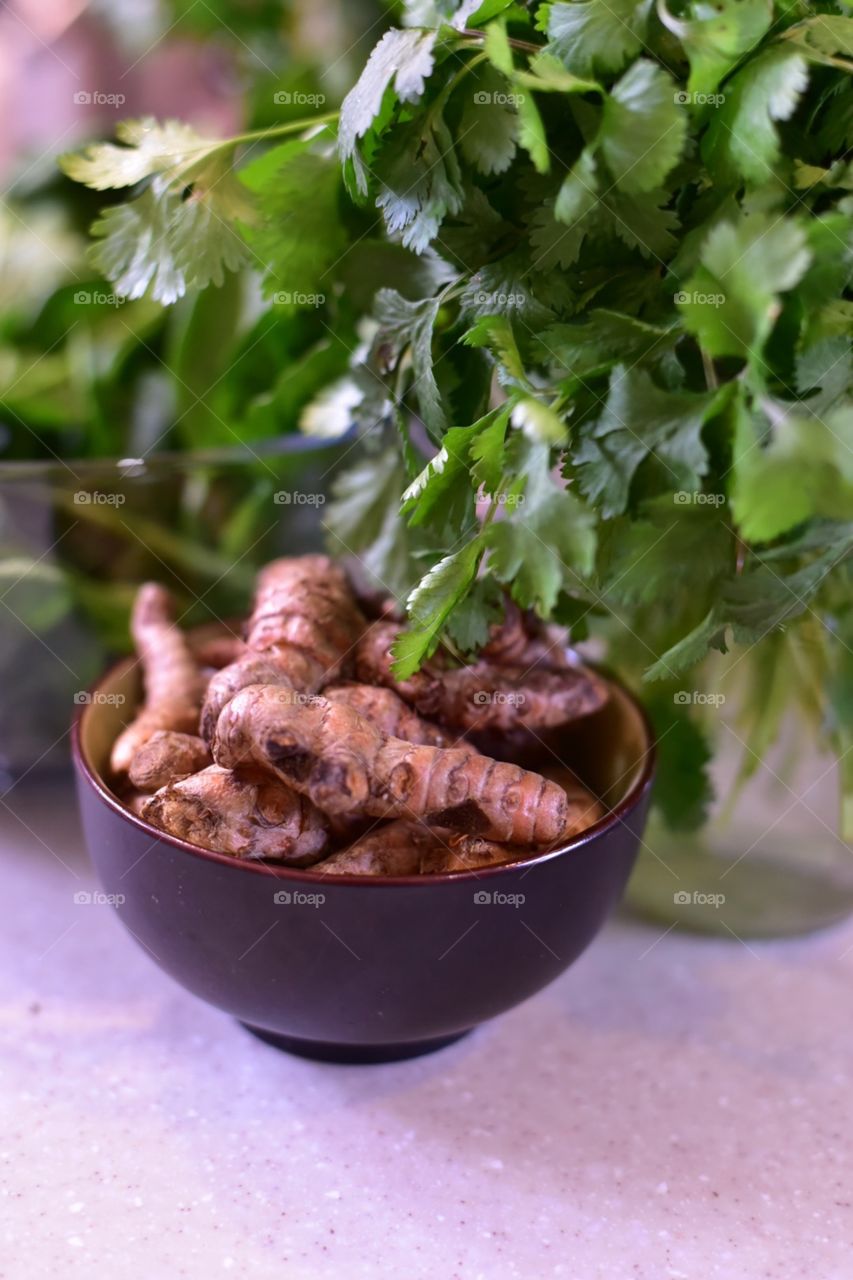 Cooking with fresh ingredients, ginger, vegetables and herbs organically grown