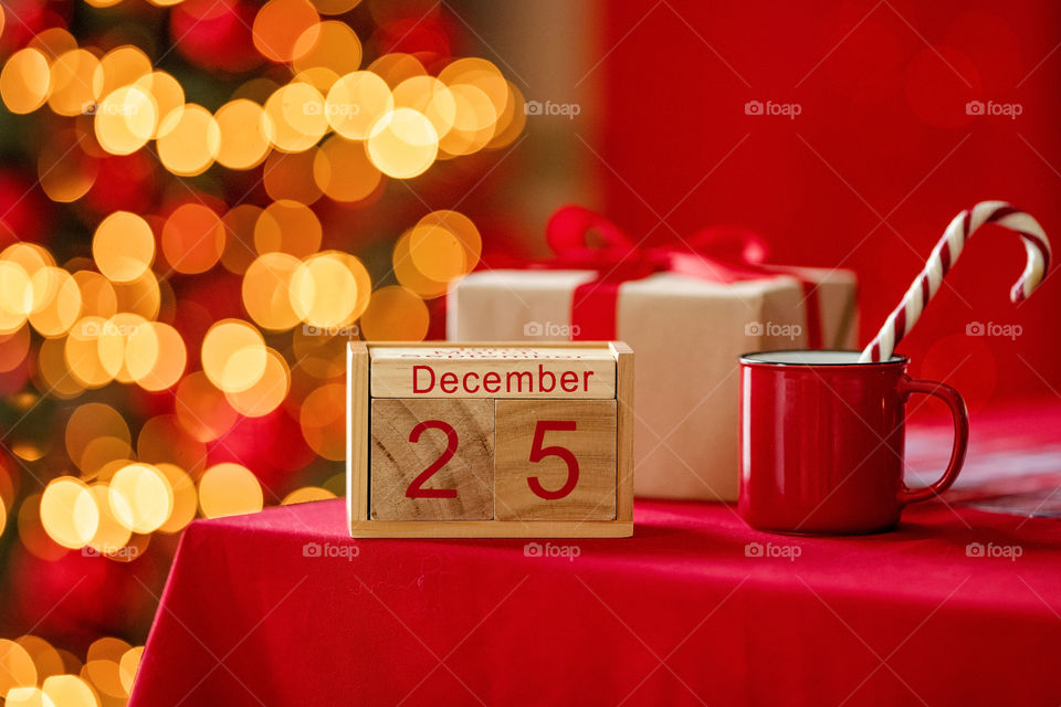 Christmas background with wooden block calendar with the date of December 25