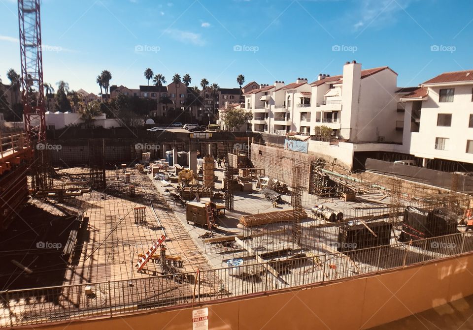 Construction site with work commencing on underground parking structure 