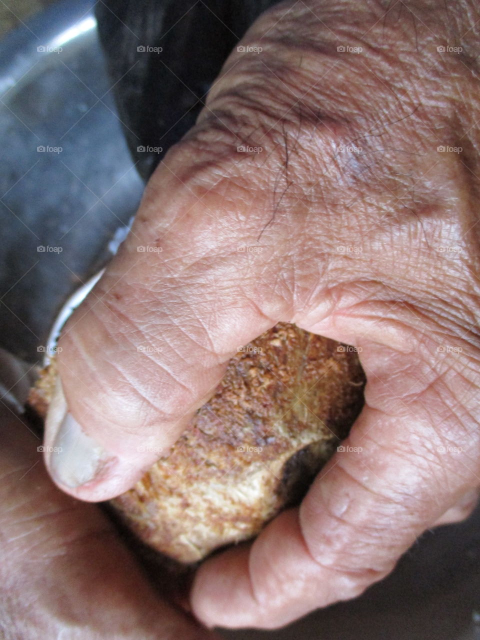 working hand with coconut