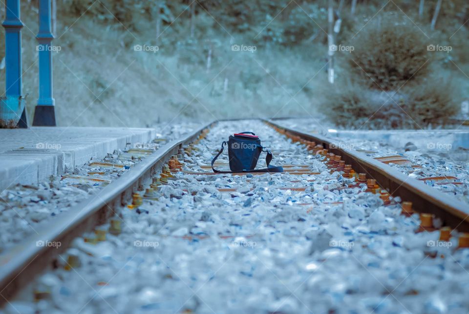 a bag is in the middle of the train tracks