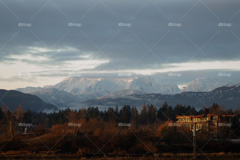 Fall or winter, which do you prefer? Fall colours in the foreground at sea level with snow in the mountains in the background. A big difference in elevation provides both seasons at once. So you can kayak or golf and ski or ice climb on the same day!