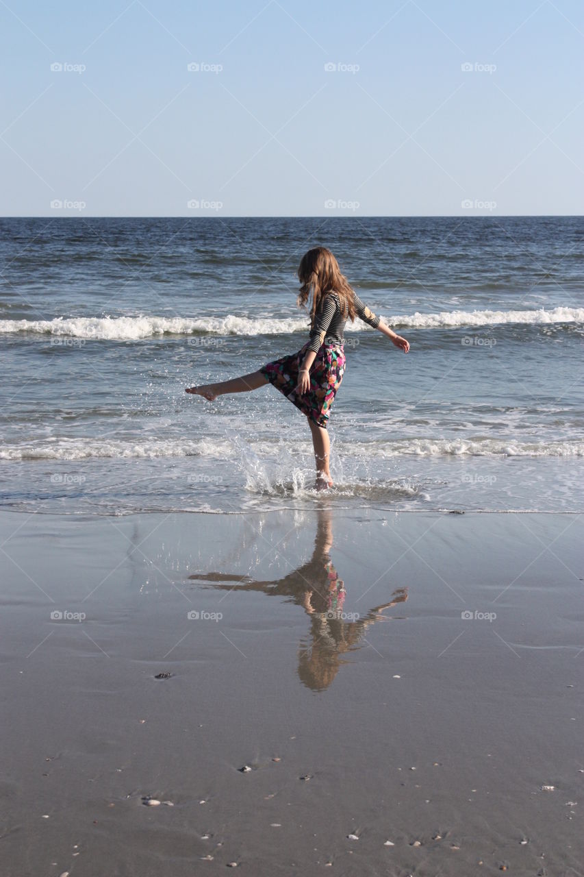 A girl walking on the beach