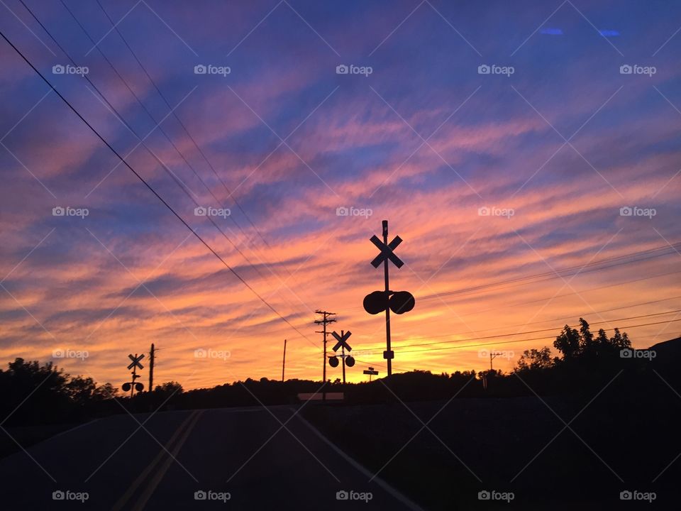 Railroad crossing at sunset 
