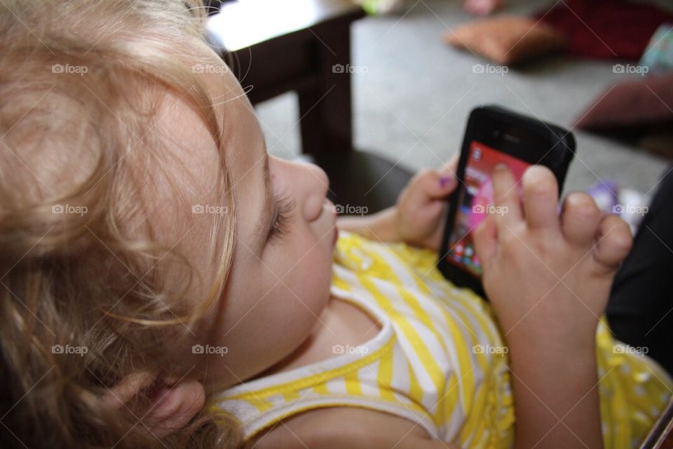 Little girl using cell phone