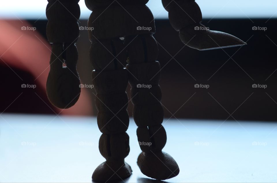 A wooden man used as an artist drawing tool walks in silhouette paying homage to Spielberg Sci-Fi classics like Close encounters of the Third Kind.