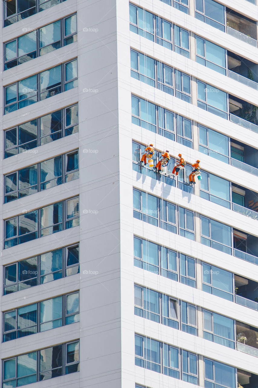 Men cleaning a building 