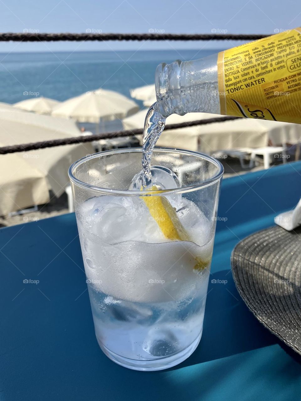 Fresh tonic glass sparkling near the beach in summertime 