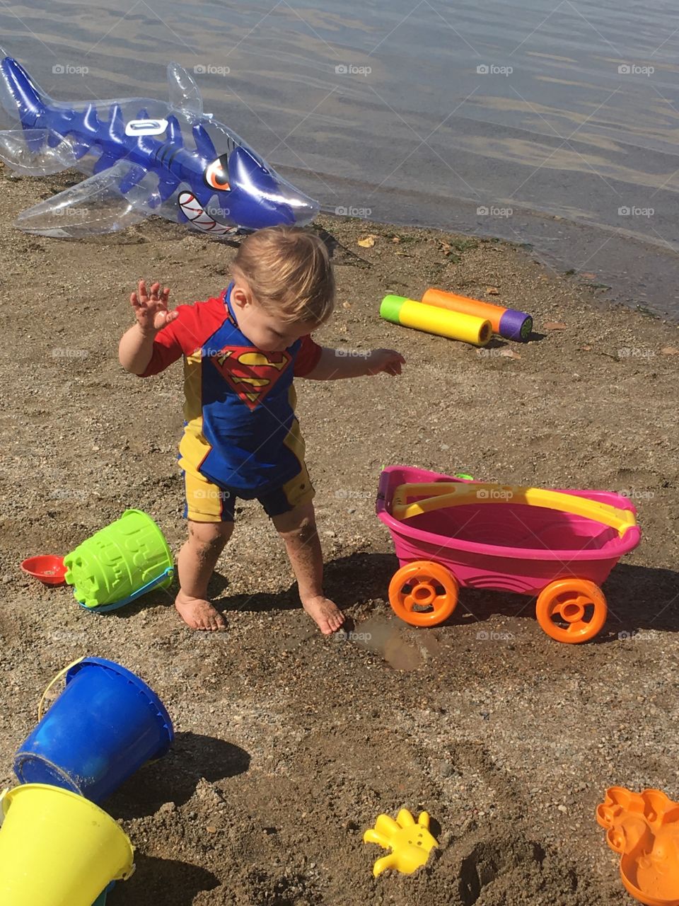 A boy can’t resist the mud 