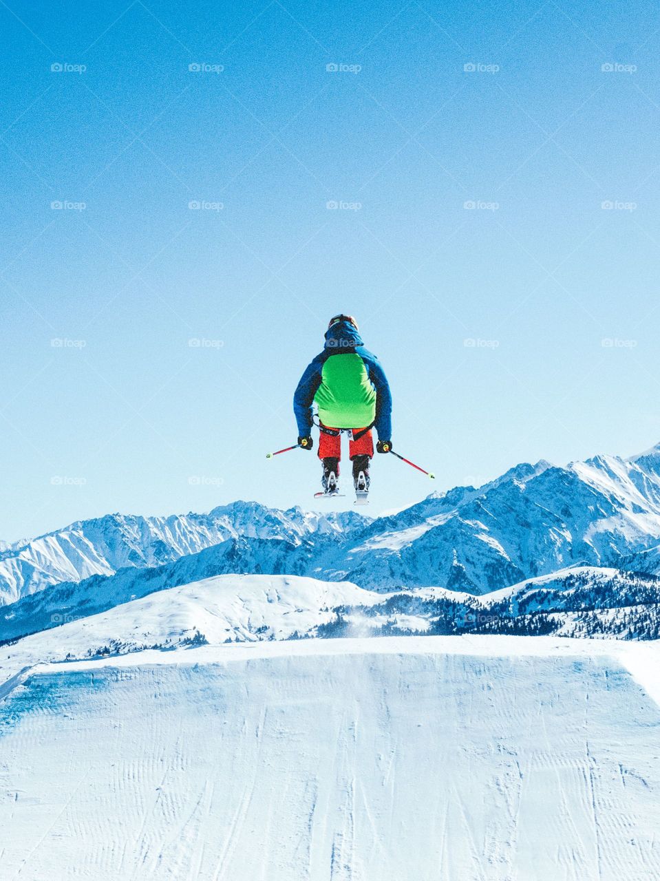 Man. Mountain. Snow. Ski. Air. Calm. Joy. Excited. Skier. Action.