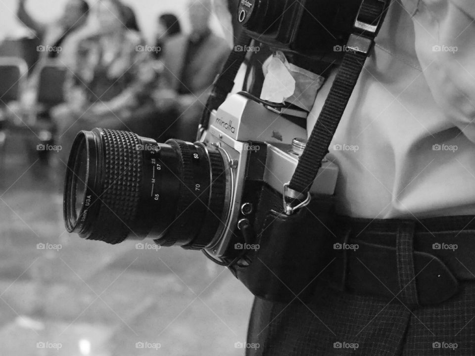 Oldschool film photographer. Old man with analog film camera