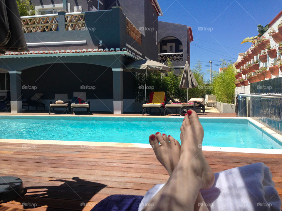 Close-up of a human leg near the pool