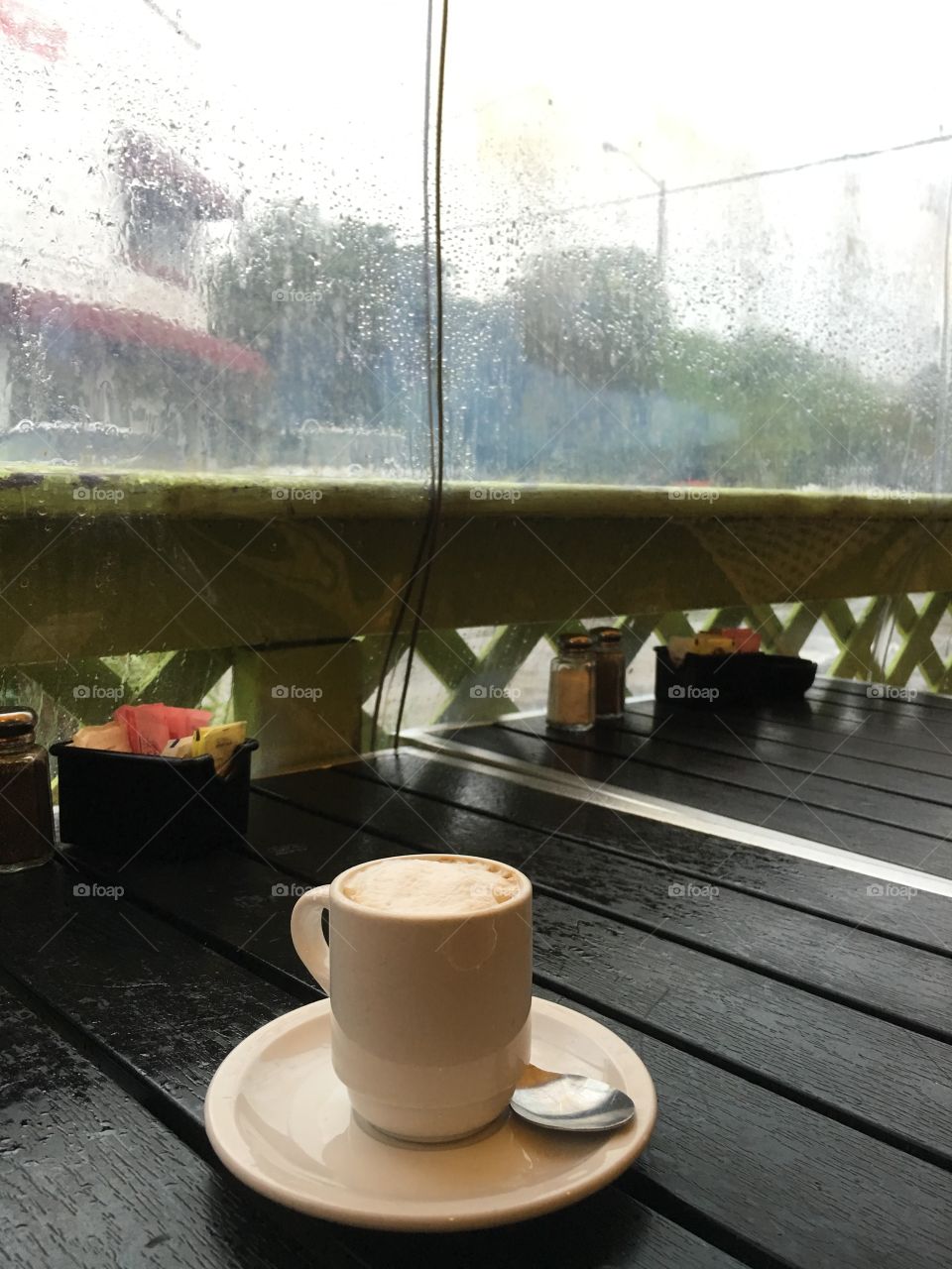 Coffee in the rain. Shot during one of Miami's afternoon showers at Buena Vista bakery in Miami