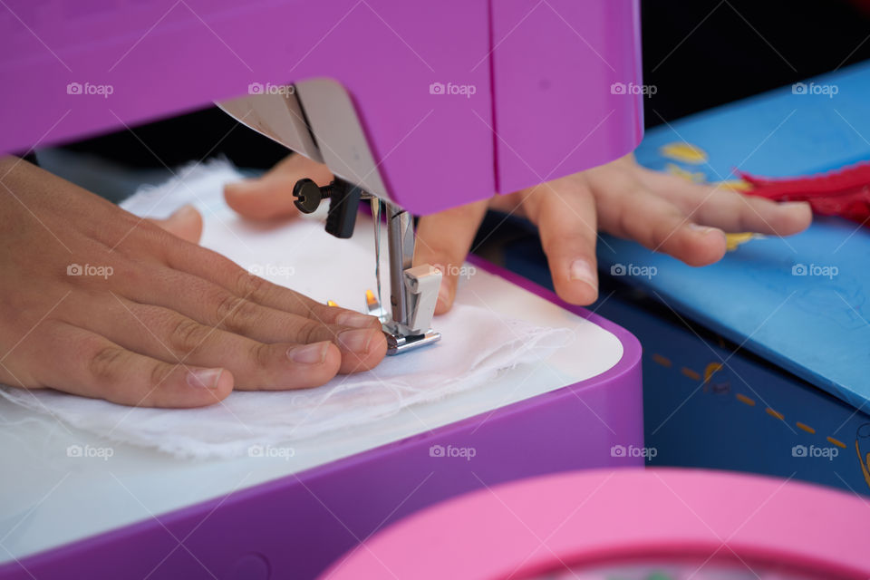 Person working on sewing machine