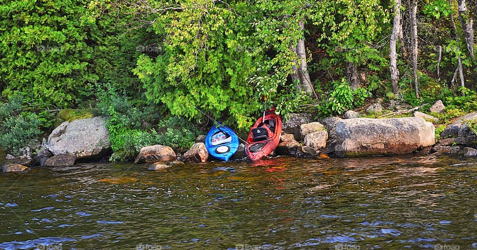 Kayaks on an island. Kayaks on island, adirondack mountains, Chateaugay lake, New York