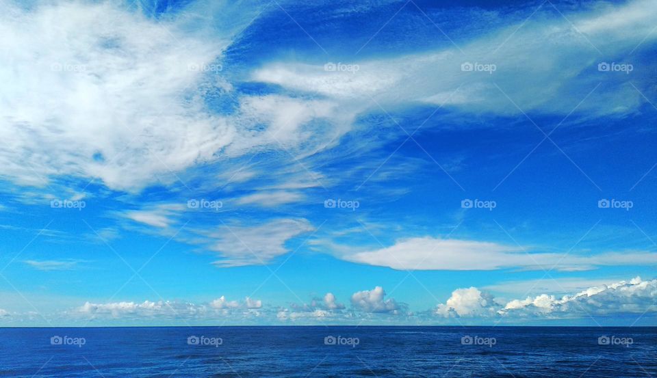 Cloud scape on the sea, unique formations form the "hand grip" of Cirrostratus.