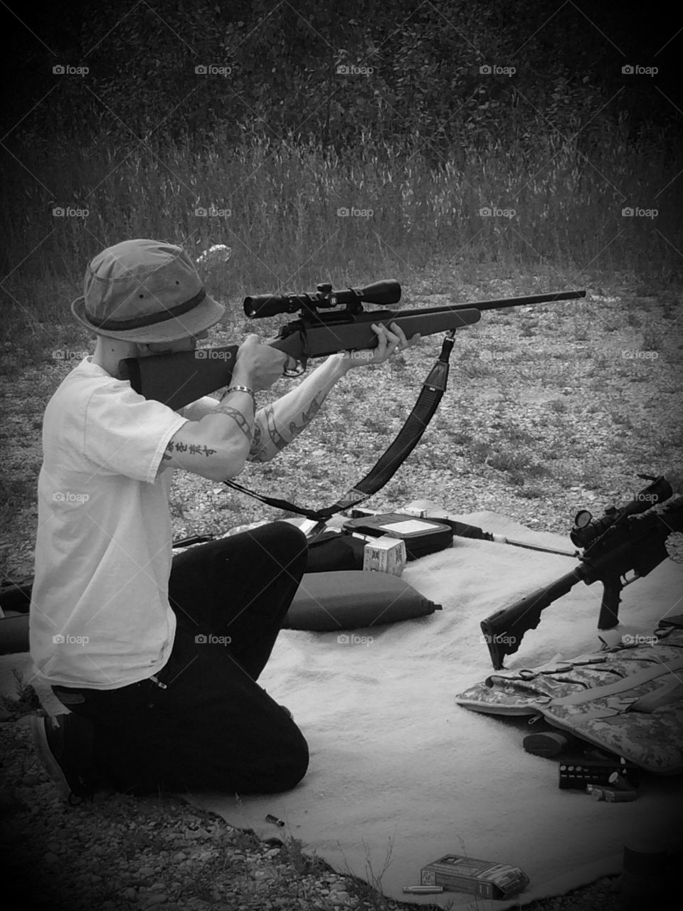 Rifleman . Man in hat taking aim