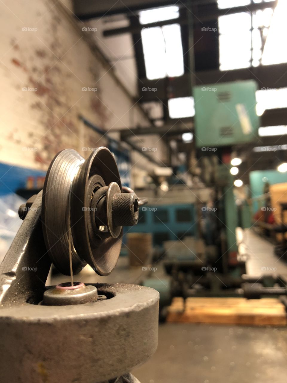Tin Copper Threaded Onto A Wheel Machine In A Cable Factory 