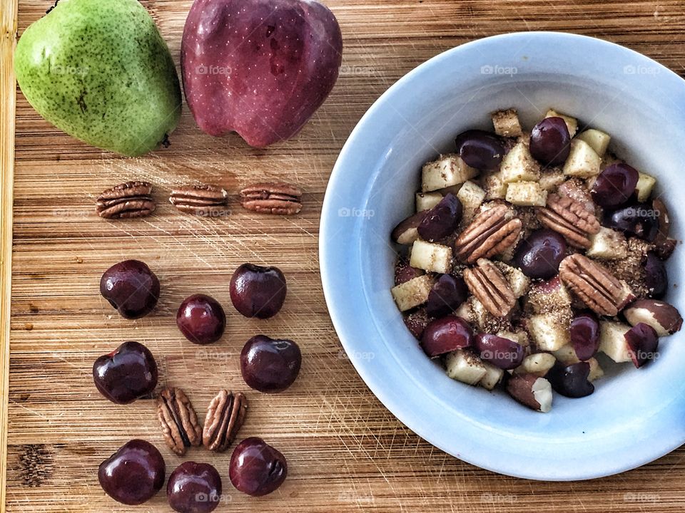 My everyday breakfast various from different fruits with different nuts like pecan, Brazil nut, hazelnut with different nutrition additives like flax seeds