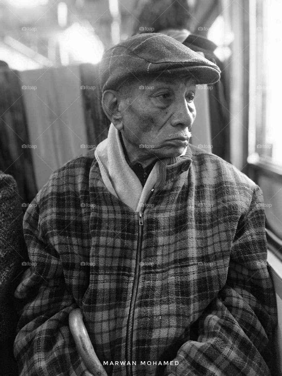 Grandfather just looking from the bus window 