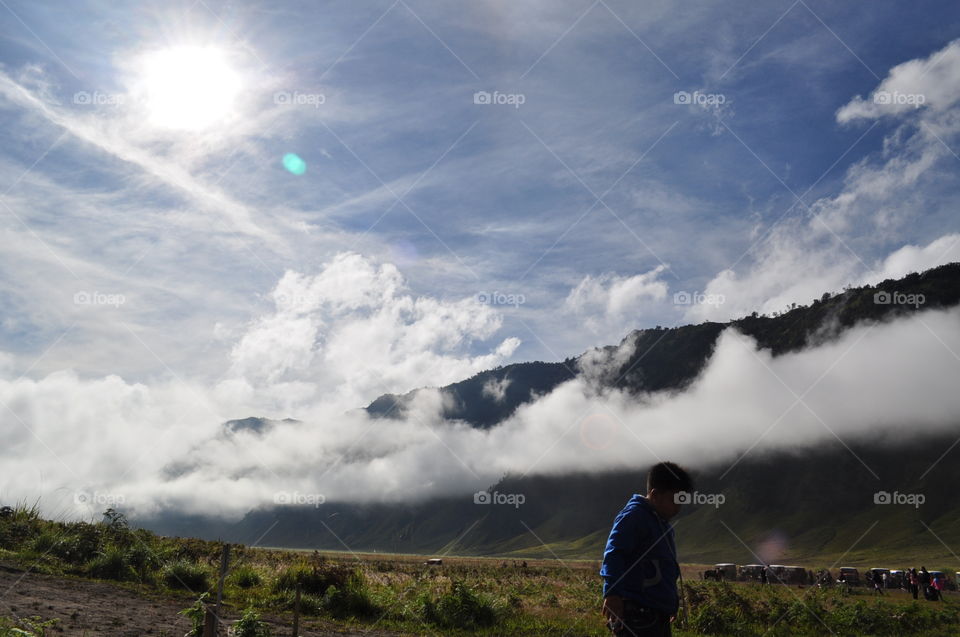cloud surrounded top of mountain