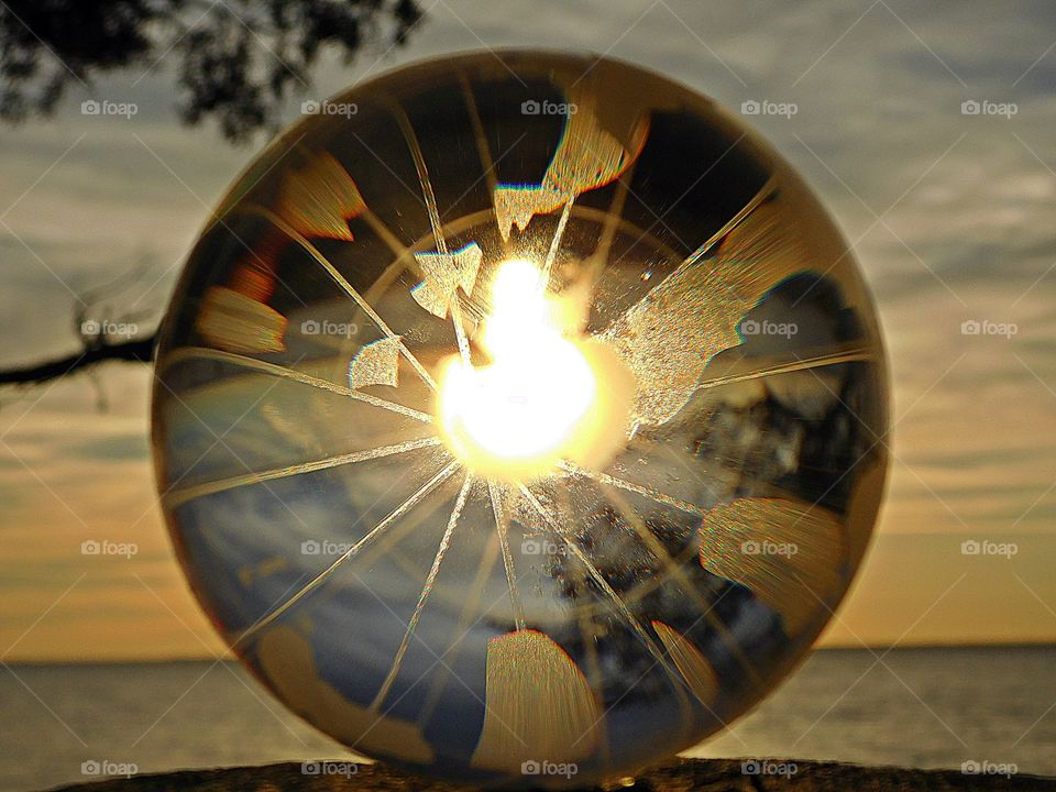 Global Sunset- sunset on the beach reflecting through the crystal ball 