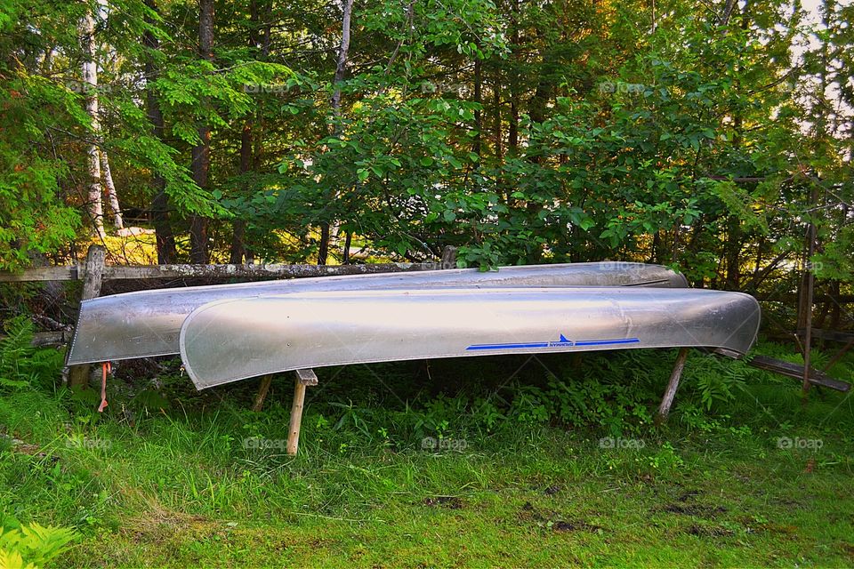 Canoes stored in backyard. Canoes stored in back yard at lake house