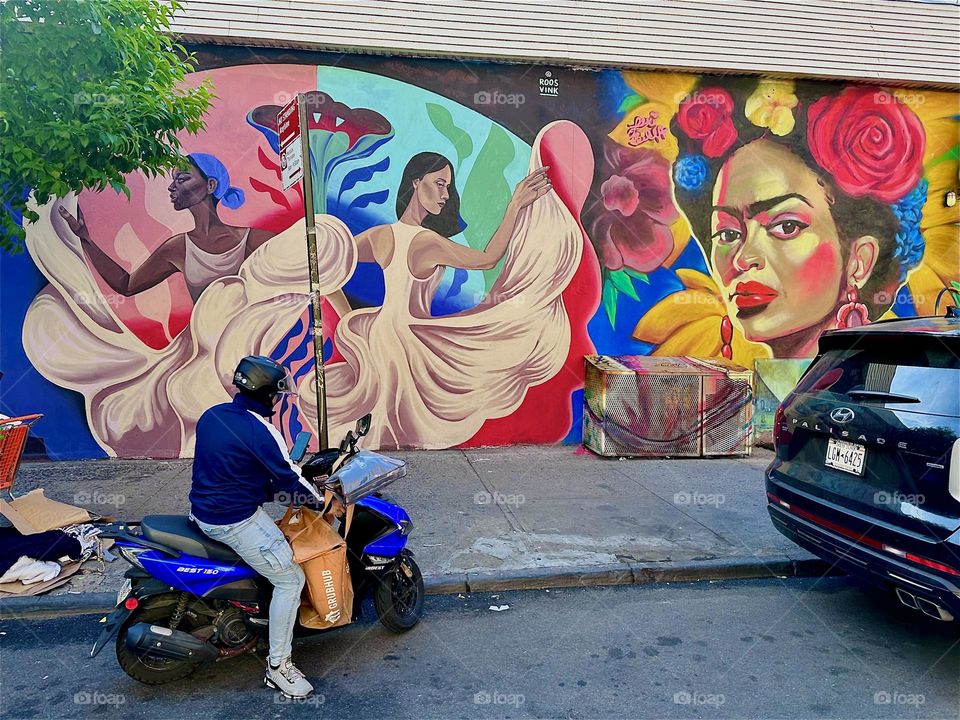 These Latin dancers with their swinging white skirts are part of a beautiful art mural on “Jefferson St” off “Broadway” and “Myrtle Ave” in “Bushwick”, Brooklyn that measures nearly an entire city block in length. 2024. Hypnotic Productions