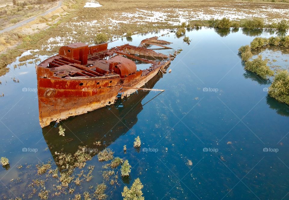 The Excelsior Shipwreck. The rusting hulk of and 1897 Steamer, decaying in the mangroves of Mutton Cove.
