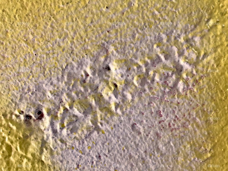 Yellow Paint on White Concrete