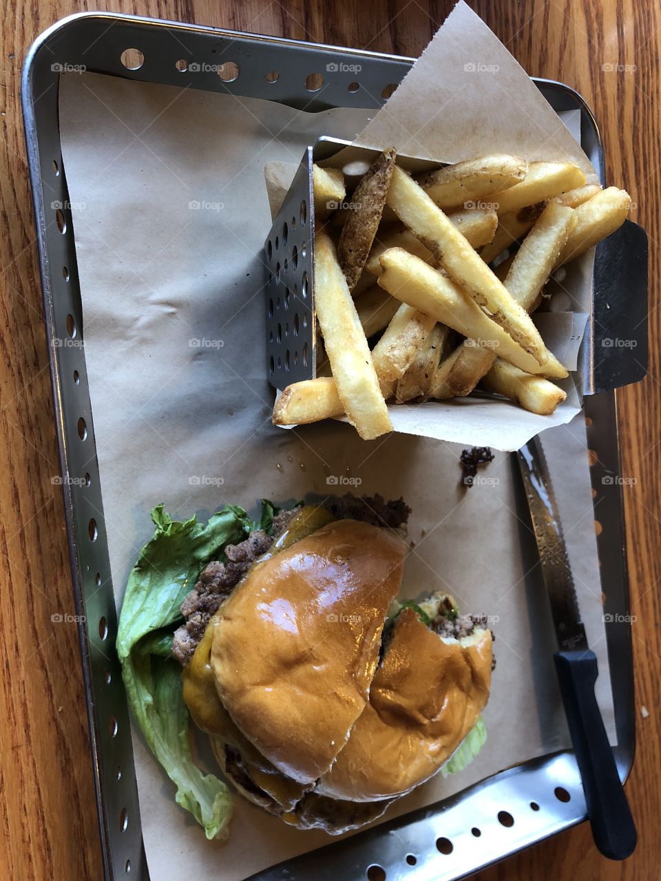 Lunch date with a burger and a basket of fries. 