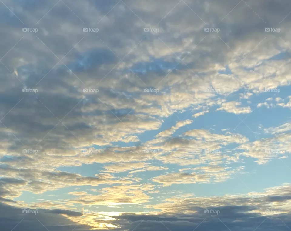 Nice early sunset with clouds in the blue sky